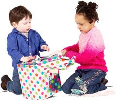 children unwrapping gift