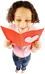 girl reading valentines day card