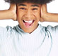 boy with hands over ears